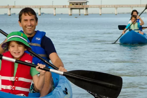 a father and son kayaking