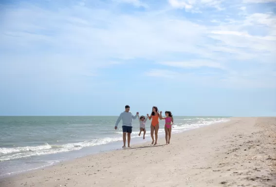 Family of 4 on beach
